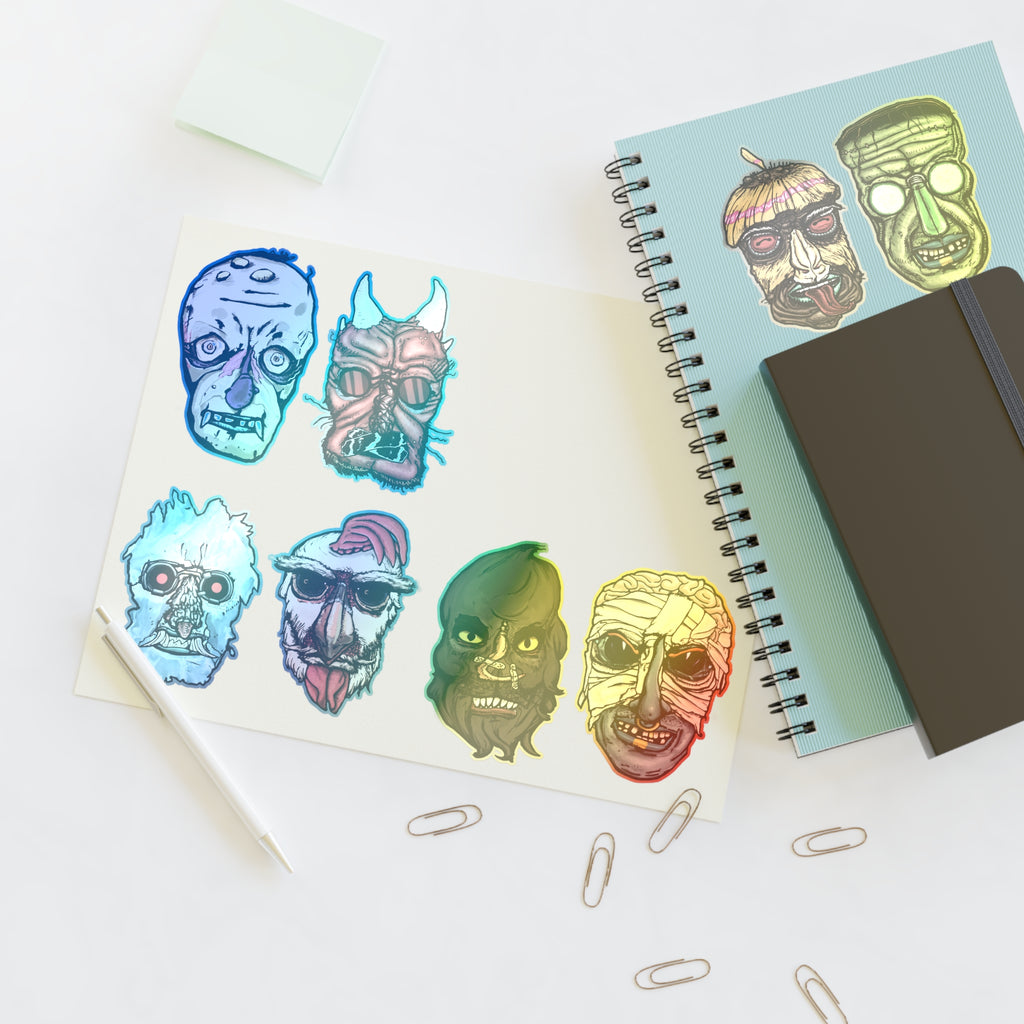 Freaky Features Sticker Sheet Set #1 , transparent die-cut sheet with 8 hand-drawn monster heads from the Freaky Features collection