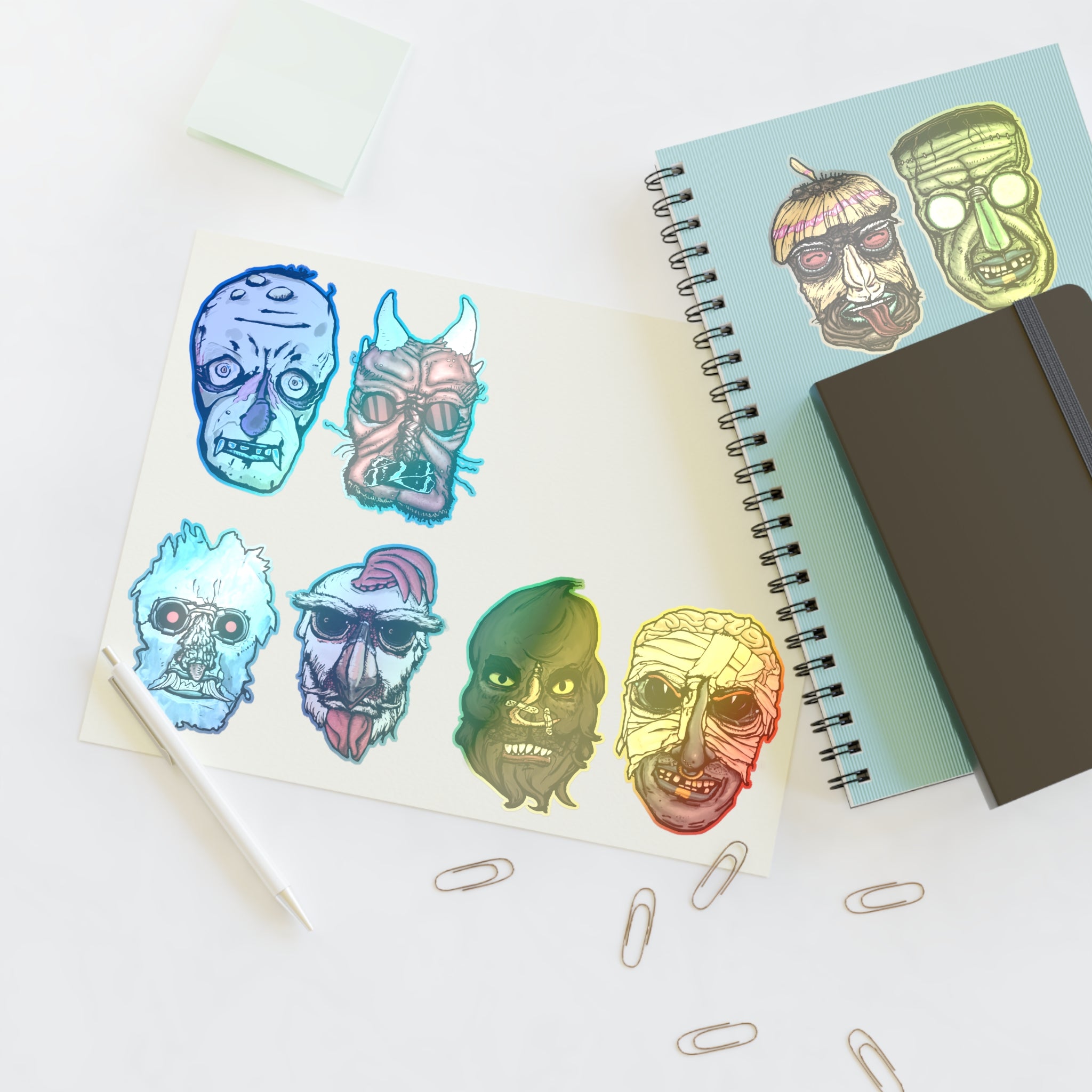 Freaky Features Sticker Sheet Set #1 , transparent die-cut sheet with 8 hand-drawn monster heads from the Freaky Features collection
