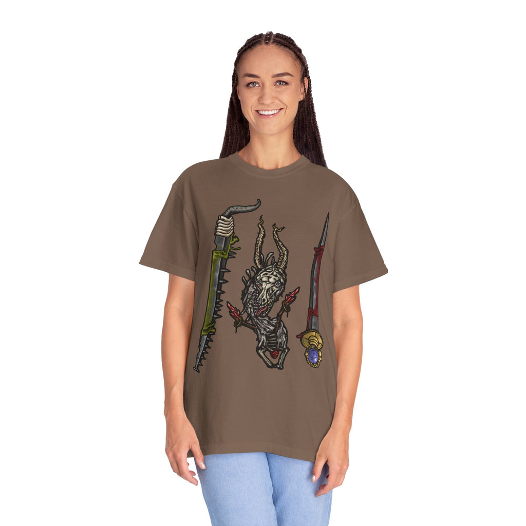 Hand-drawn Item Selection #2 t-shirt from Freaky Features showing a reptilian monster holding a chainsaw sword, bloody dagger and twisted staff on cream tee

