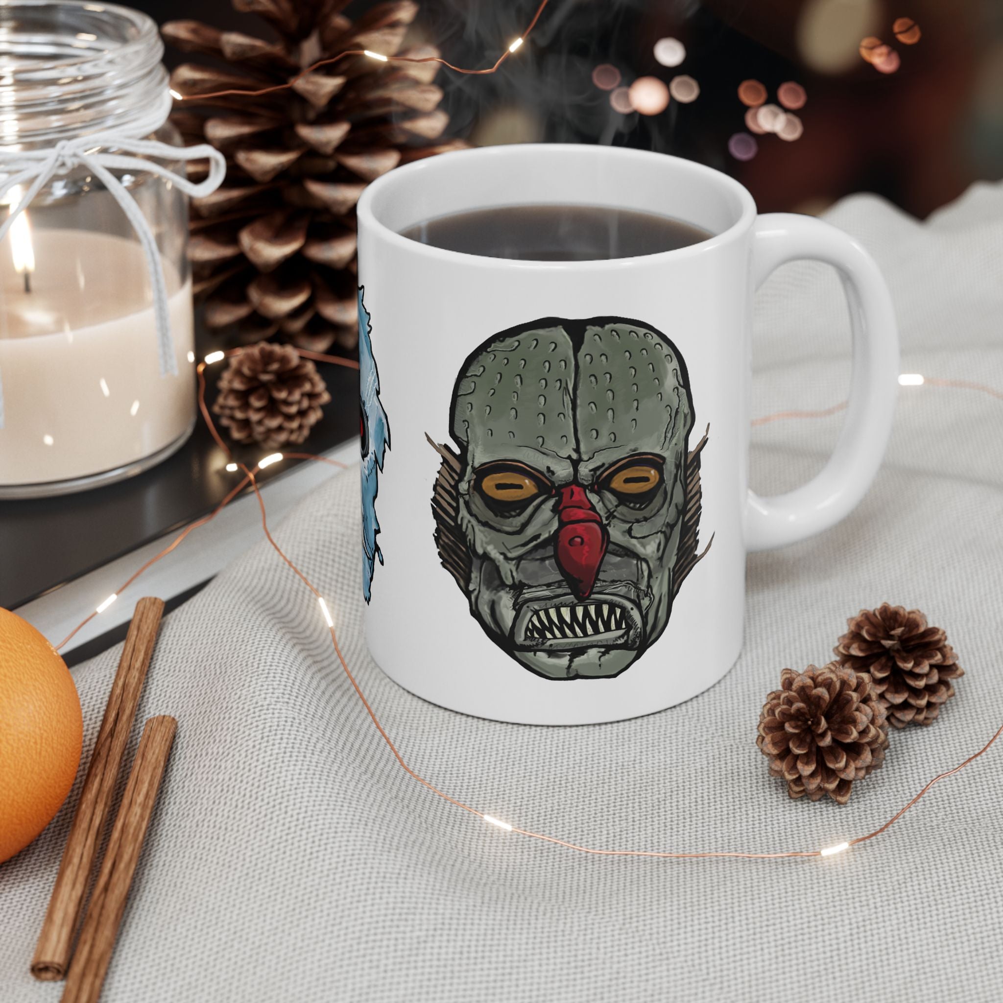 Freaky Features Iceman Devil Fishman mug showing three monster designs: blue icy skull with red goggles, red horned demon, and grotesque fishman head on white ceramic mug

