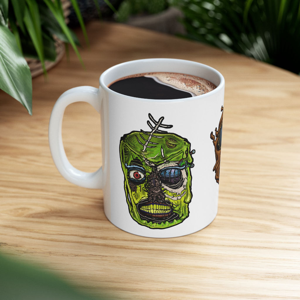 Freaky Features Sandman Radioactive Blob Shaman mug showing three monster designs: melting chocolate head with ice cream nose, neon green radioactive blob skull, and tribal shaman mask on white ceramic mug

