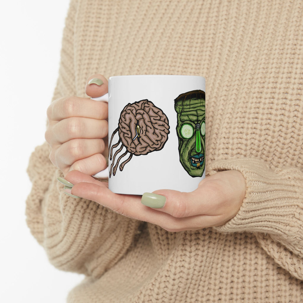 Freaky Features Frankie & the Brians mug showing three monster designs: Franky ( Frankenstein ), purple sad brain with tentacles, and floating brain with glassy eye
