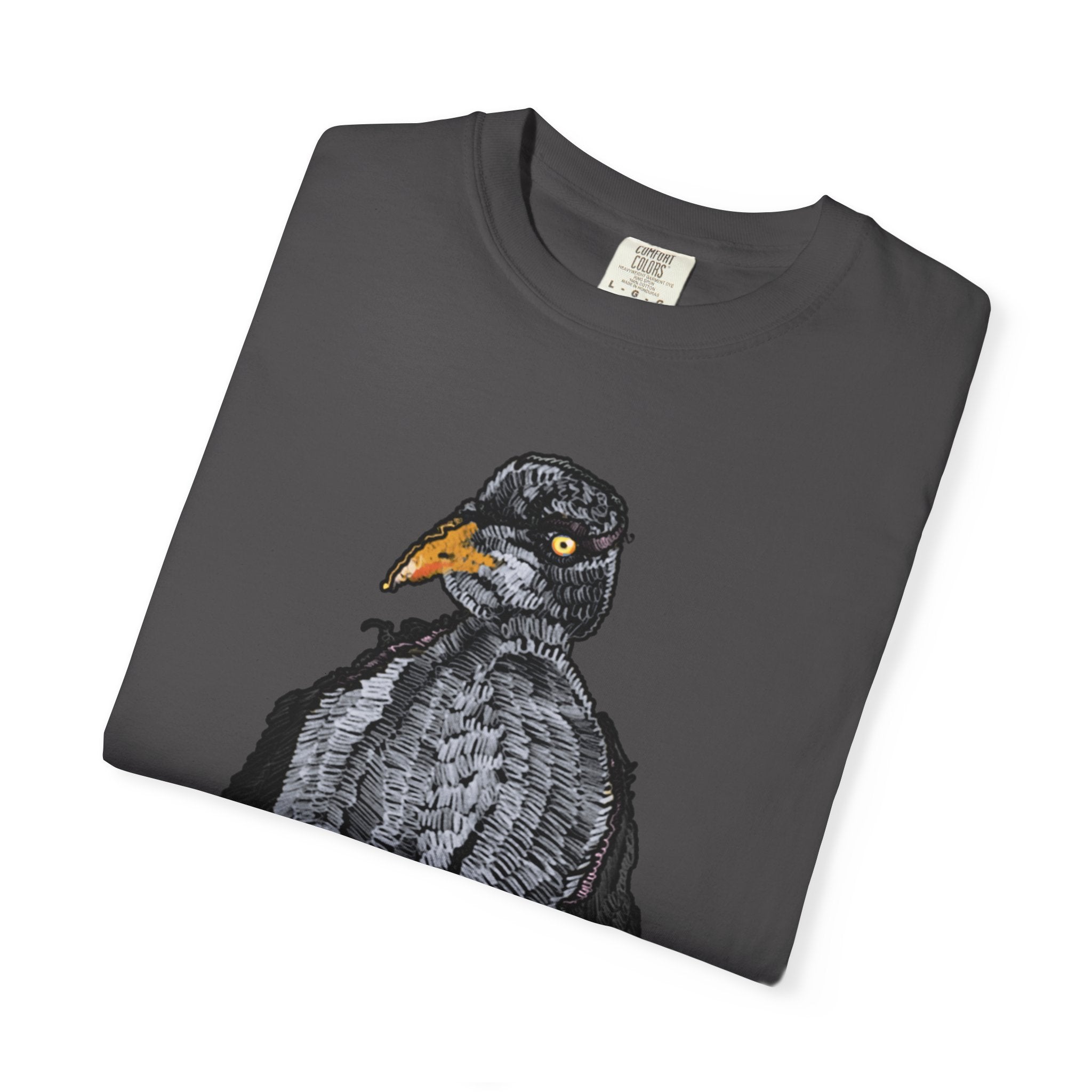 Hand-drawn crocheted staring seagull t-shirt with textured feathers, intense yellow eye and orange legs on Comfort Colors tee from PizzaBytes collection
