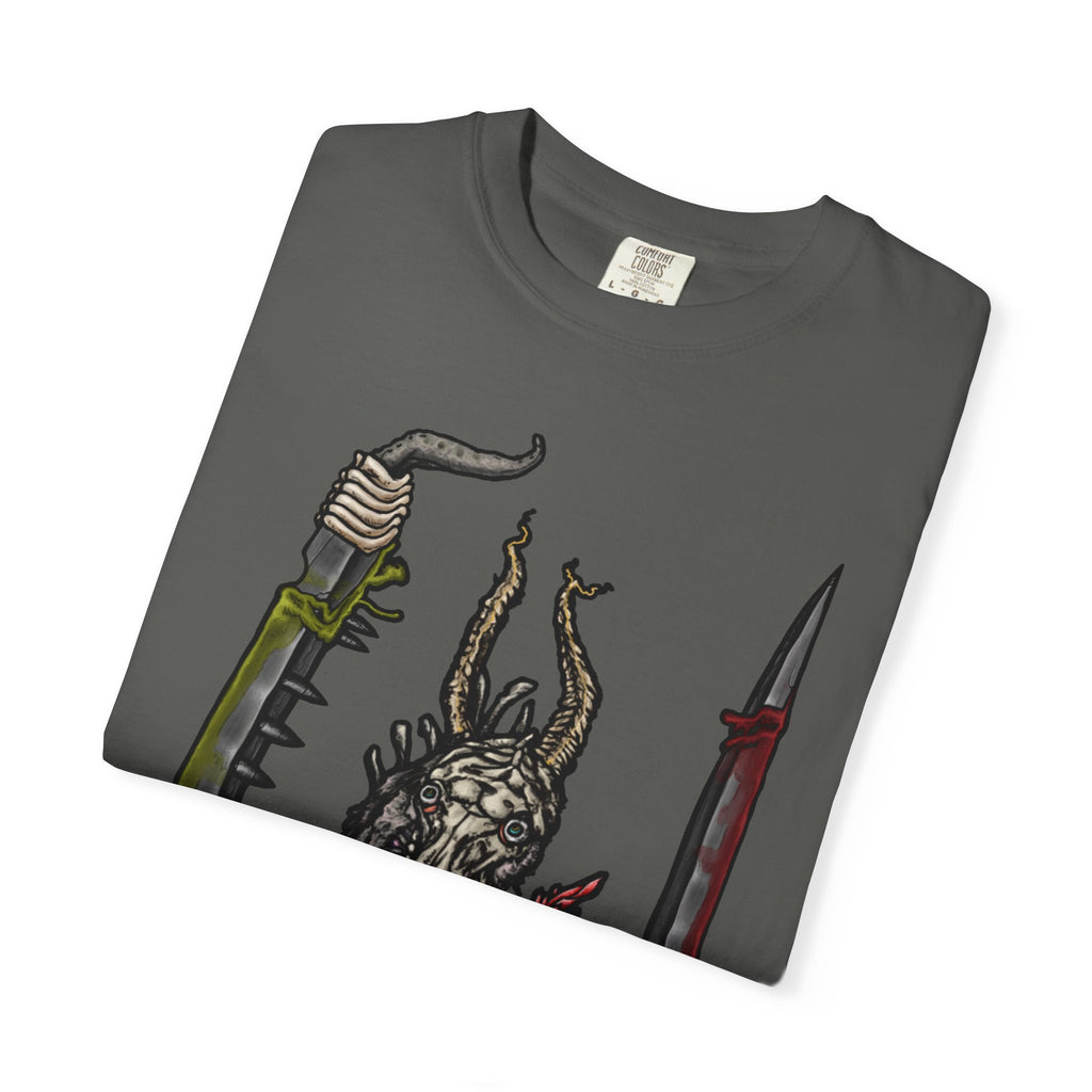 Hand-drawn Item Selection #2 t-shirt from Freaky Features showing a reptilian monster holding a chainsaw sword, bloody dagger and twisted staff on cream tee

