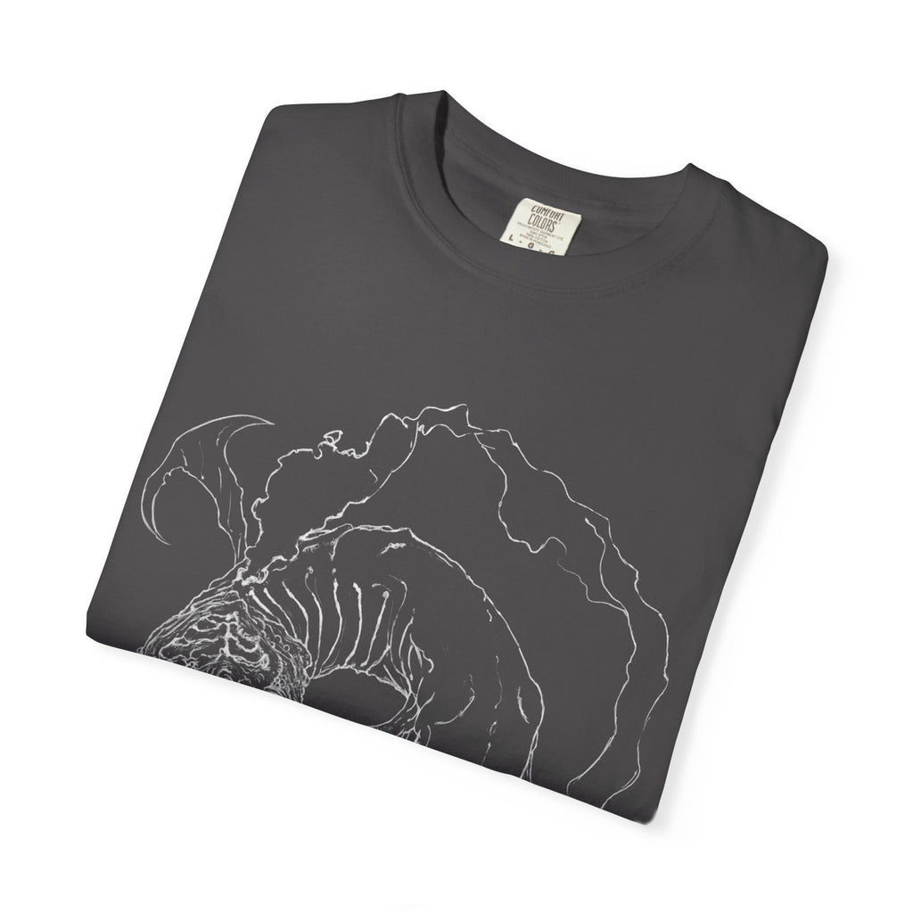 Hand-sketched Fish Monster t-shirt from Serenity Chain collection, eerie deep-sea creature with bulging eyes and flowing fins in white line art on black tee