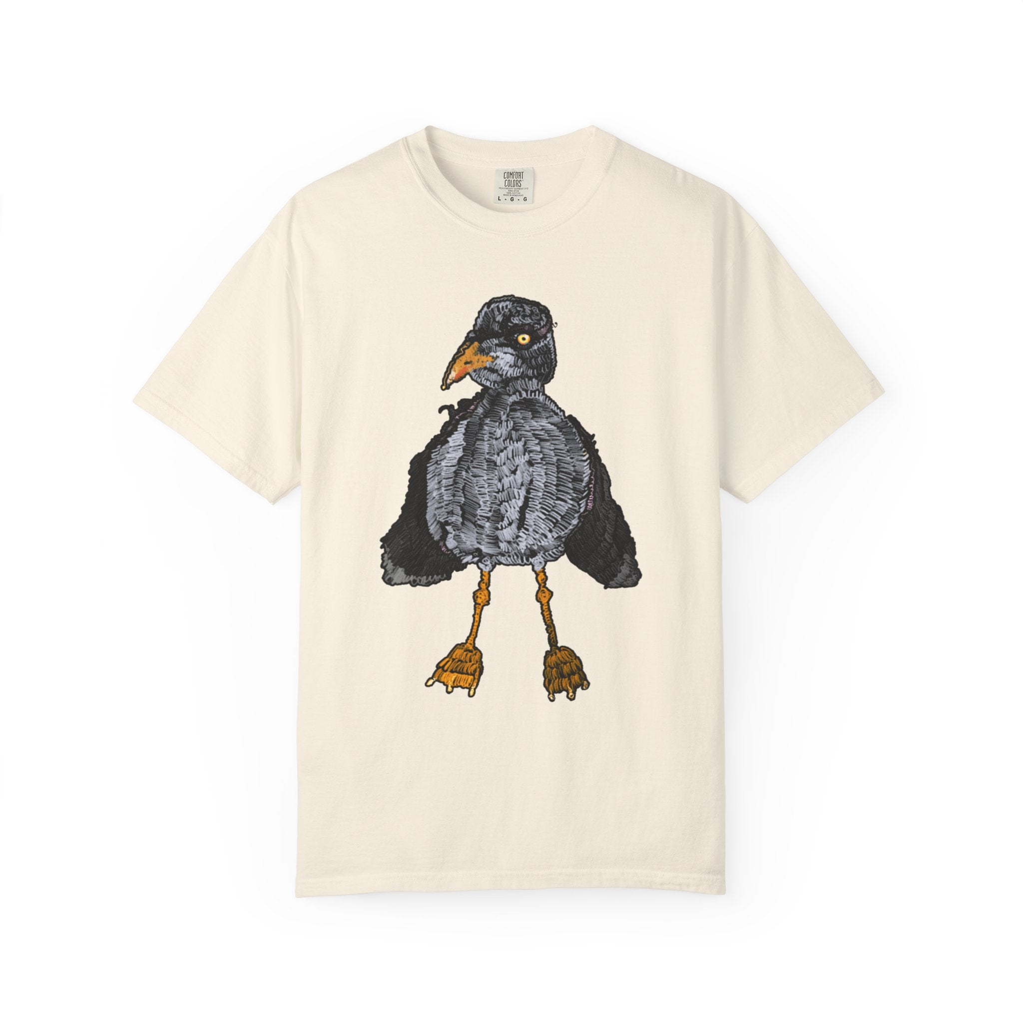 Hand-drawn crocheted staring seagull t-shirt with textured feathers, intense yellow eye and orange legs on Comfort Colors tee from PizzaBytes collection

