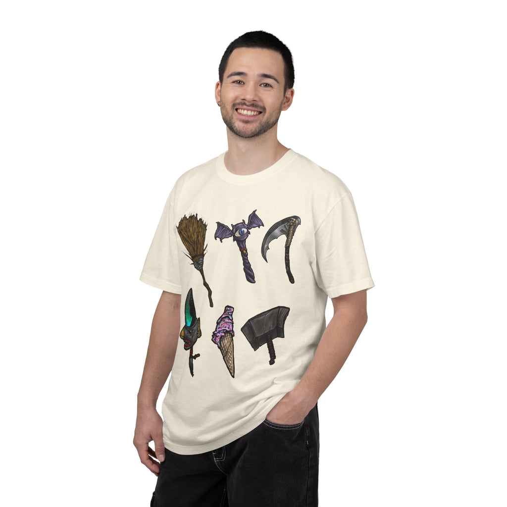 Hand-drawn Item Selection #1 t-shirt from Freaky Features showing a collection of monster weapons: broom, bat staff, skeletal scythe, shark dagger, ice cream cone and war hammer on dark gray tee
