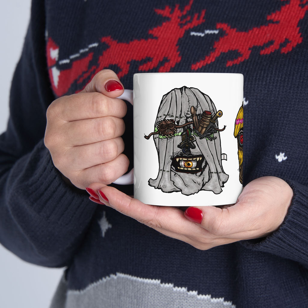 Freaky Features Ghost HorrorBird Flaming Skull mug showing three monster designs: creepy ghost with weapons, horror rooster, and flaming skull with chili nose on white ceramic mug