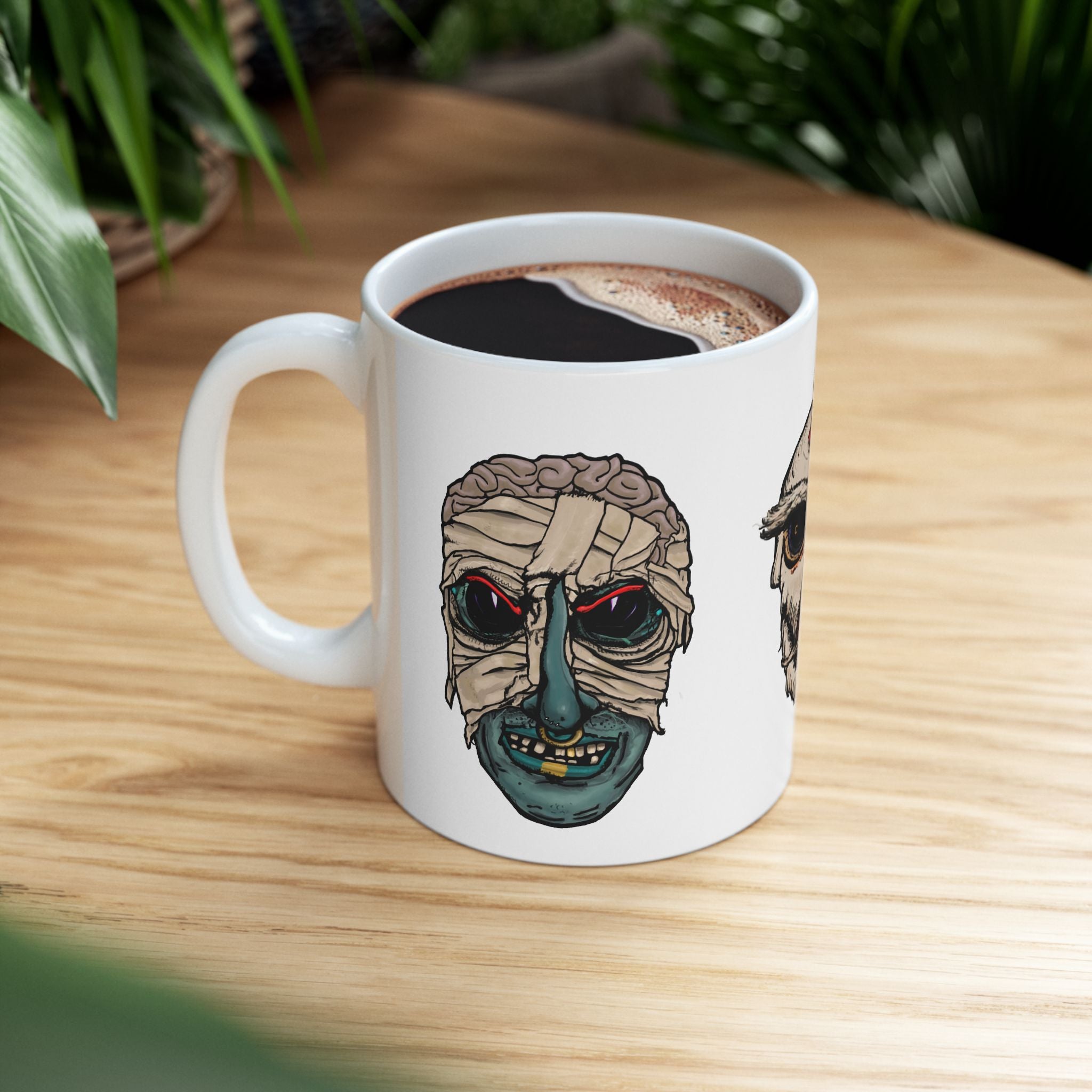Freaky Features Mummy Chicken Mushroom mug showing three monster designs: bandaged mummy with exposed brain, paranoid rooster with sunglasses, and multi-eyed mushroom skull on white ceramic mug
