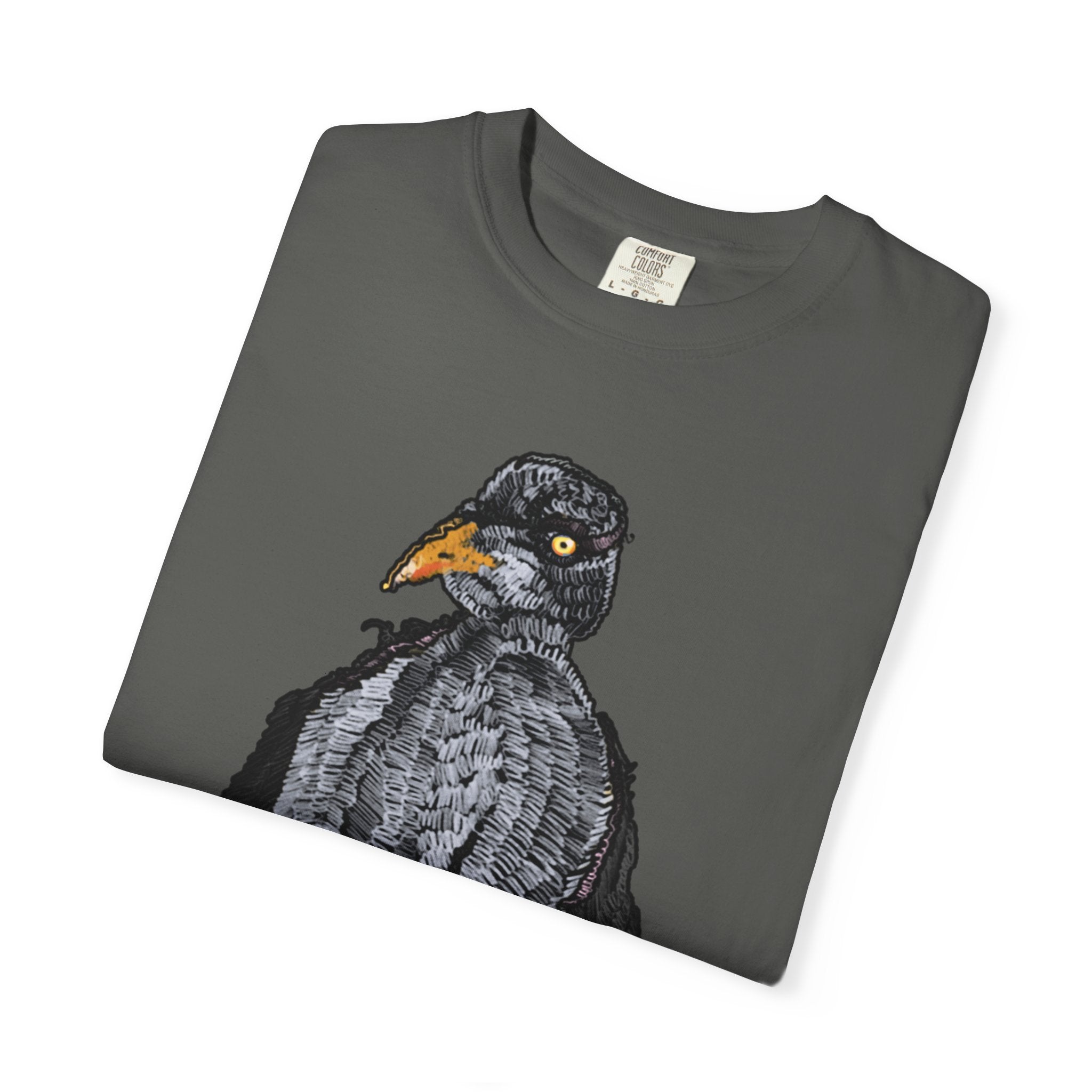 Hand-drawn crocheted staring seagull t-shirt with textured feathers, intense yellow eye and orange legs on Comfort Colors tee from PizzaBytes collection

