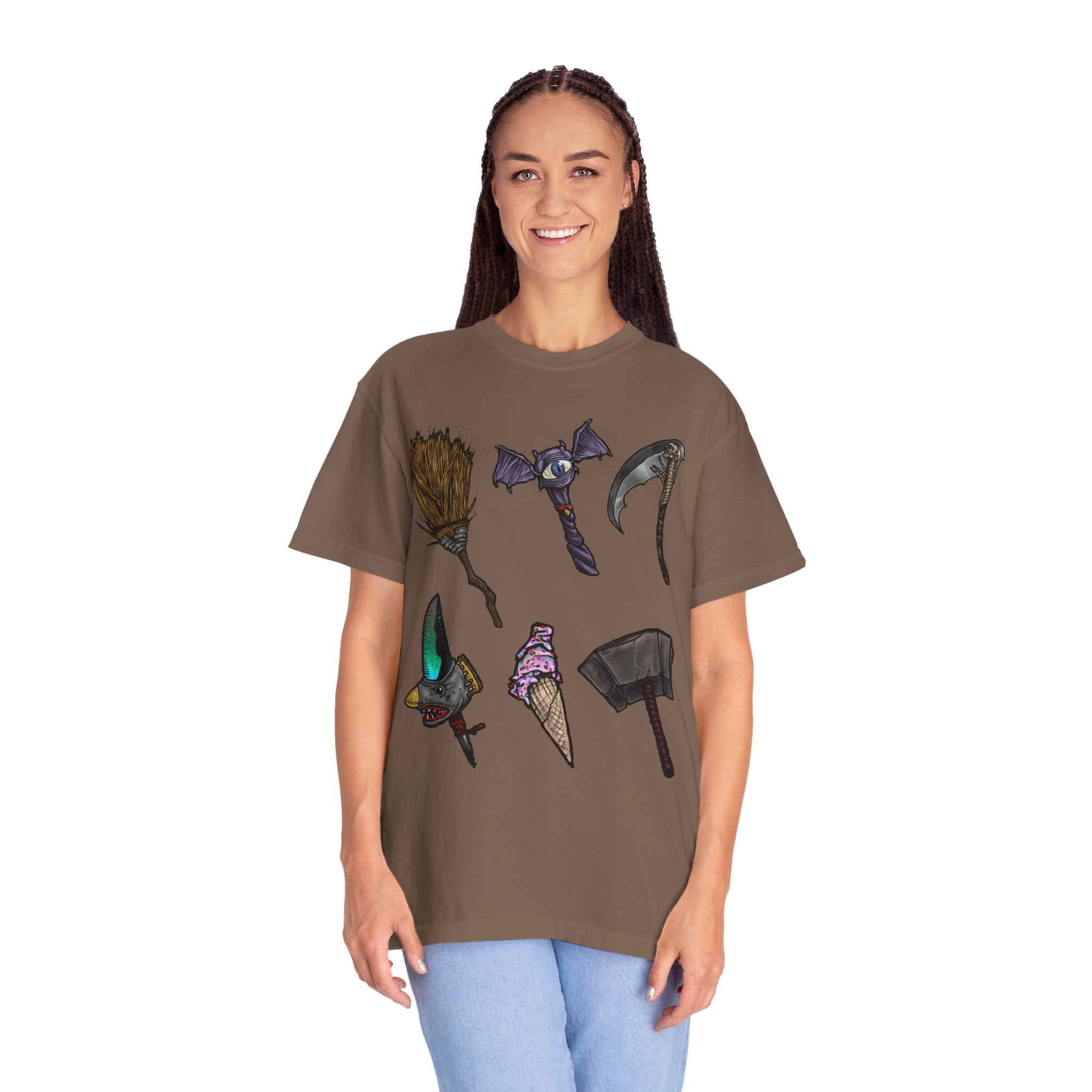 Hand-drawn Item Selection #1 t-shirt from Freaky Features showing a collection of monster weapons: broom, bat staff, skeletal scythe, shark dagger, ice cream cone and war hammer on dark gray tee
