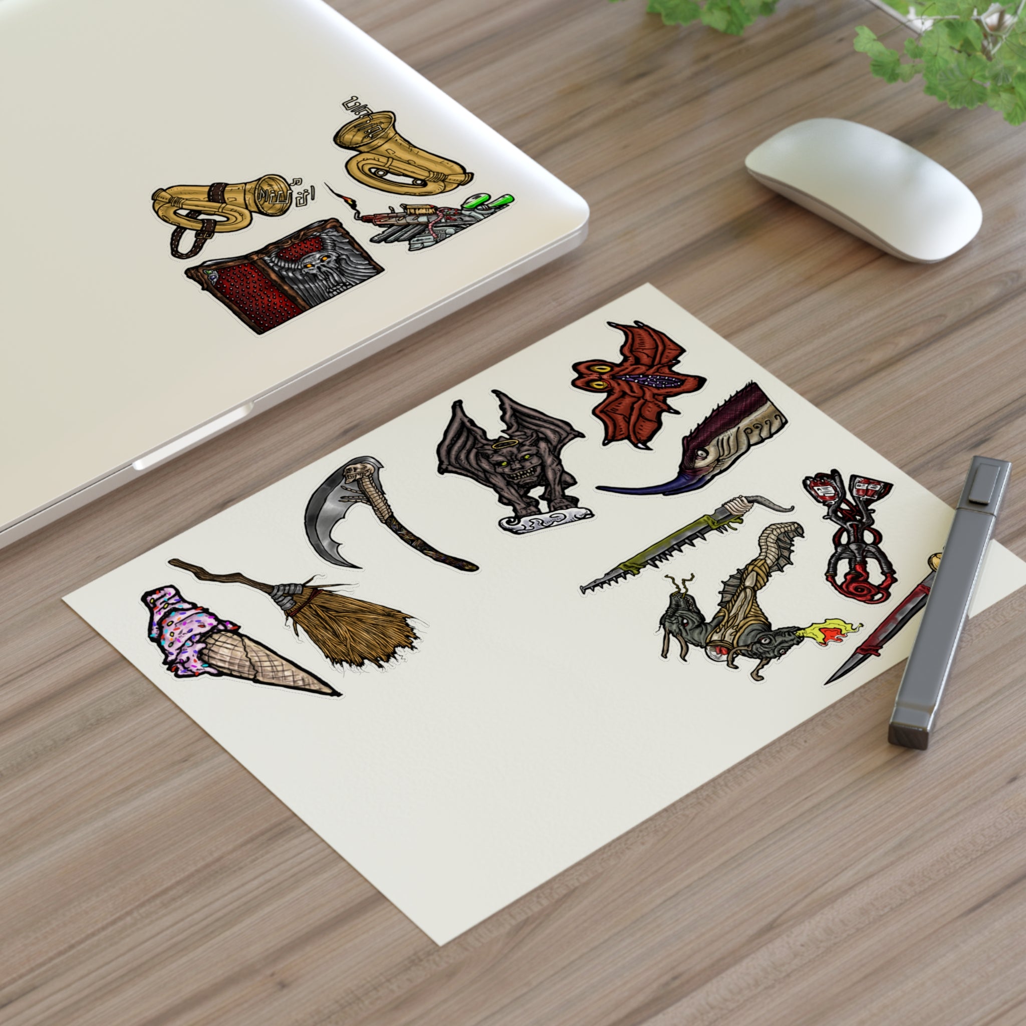 Freaky Features Sticker Sheet Set #4, transparent die-cut sheet with 14 hand-drawn weapons and creatures including ice cream cone, witch broom, skeletal scythe, bat-winged hellbeast, cursed tome and more
