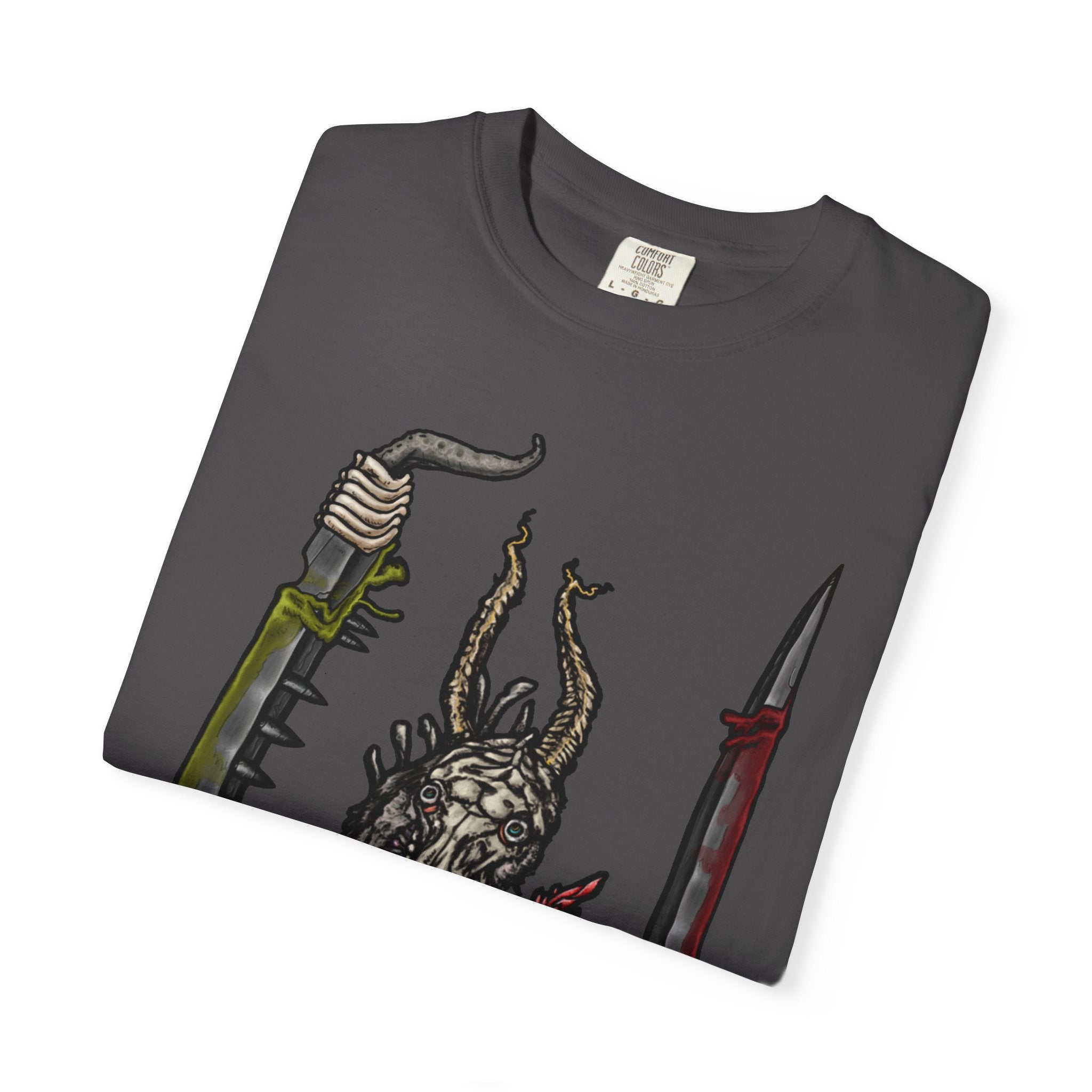 Hand-drawn Item Selection #2 t-shirt from Freaky Features showing a reptilian monster holding a chainsaw sword, bloody dagger and twisted staff on cream tee

