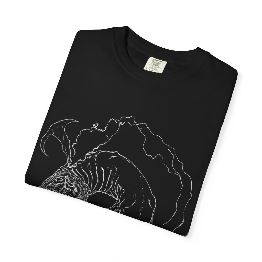 Hand-sketched Fish Monster t-shirt from Serenity Chain collection, eerie deep-sea creature with bulging eyes and flowing fins in white line art on black tee