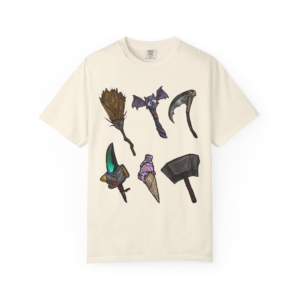 Hand-drawn Item Selection #1 t-shirt from Freaky Features showing a collection of monster weapons: broom, bat staff, skeletal scythe, shark dagger, ice cream cone and war hammer on dark gray tee
